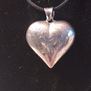 Silver puffy heart engraved with 16" black cord